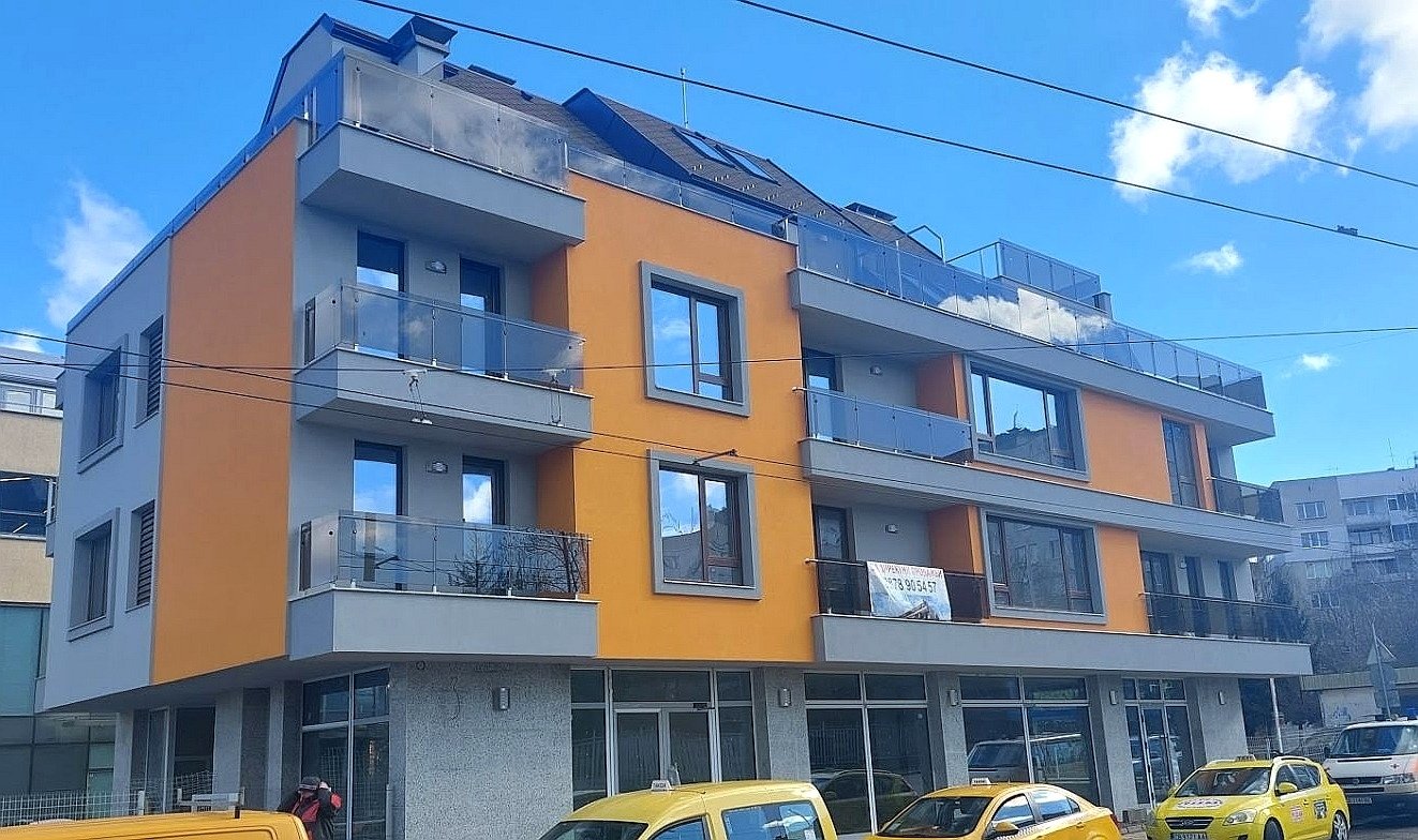 apartments with glasses railings yellow and brown