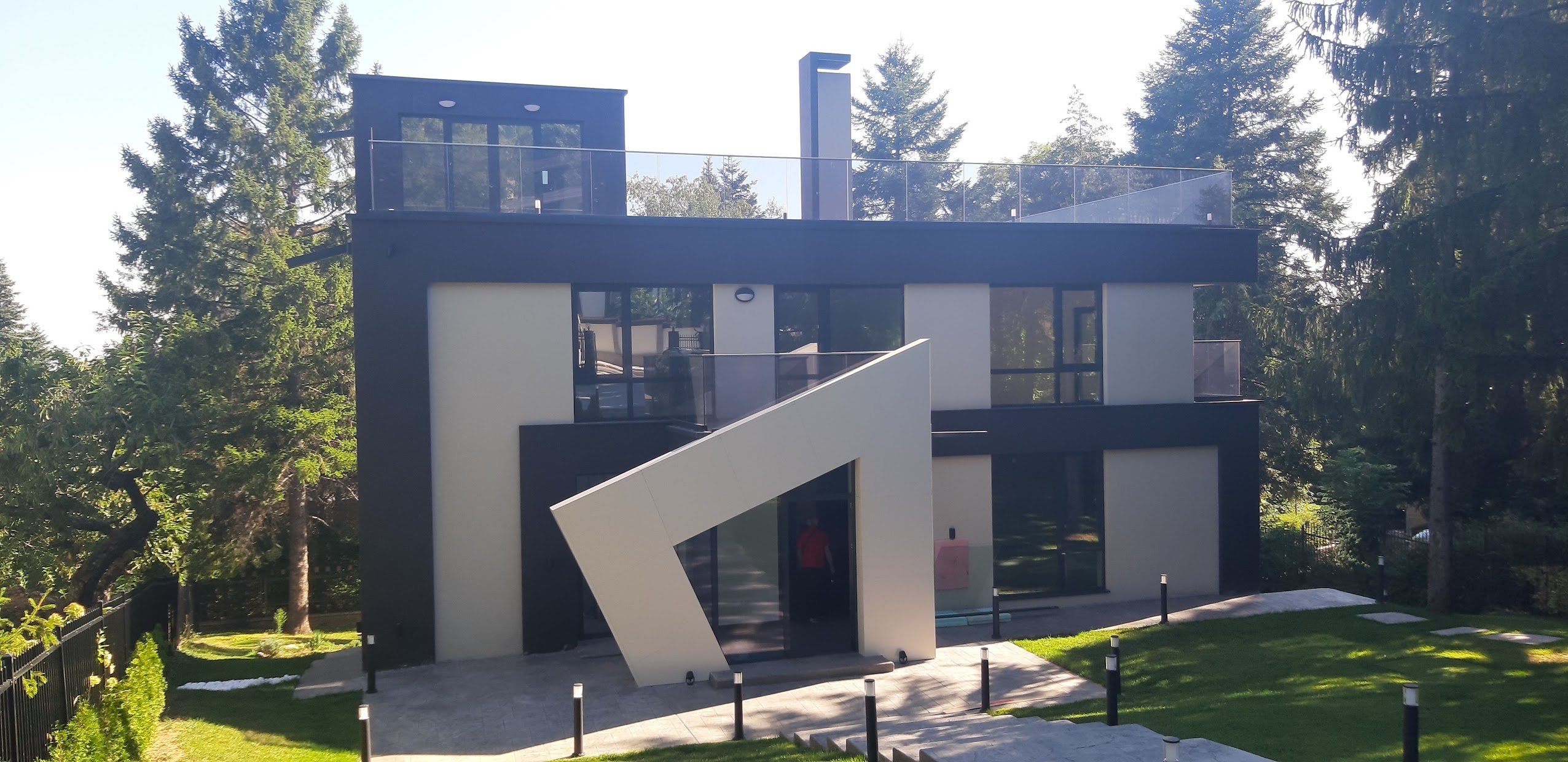 beautiful house with glass railings black and white